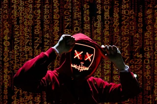 Cyber criminal wearing a mask